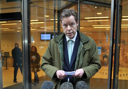 George Bingham, the only son of missing peer Lord Lucan, speaks to the media outside the High Court in London. (Nick Ansell/PA via AP)
