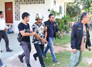 Police take away Tatpong Thamnai to face charges of burglary, murder and necrophilia.