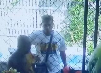 Police are looking for Somchai Boonsri, captured on close-circuit camera grabbing and holding a blade to the throat of a 70-year-old monk in a fit of rage.