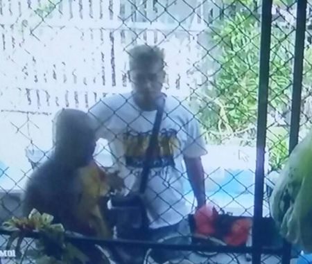 Police are looking for Somchai Boonsri, captured on close-circuit camera grabbing and holding a blade to the throat of a 70-year-old monk in a fit of rage.