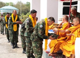 Buddhist monks bless the soldiers before they embark on their mission.