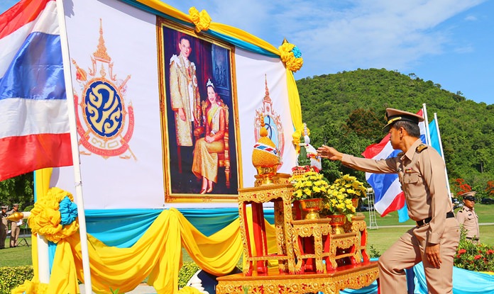 Capt. Saman Kantaphan, commander of the Naval Recruit Training Center, leads a Sattahip community cleanup in honor of HM the King.