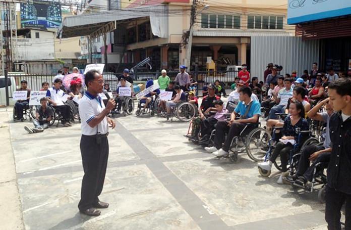 Hundreds of disabled students and residents of four Pattaya communities demanded city officials inform them when a long-delayed wheelchair-accessible pedestrian bridge over Sukhumvit Road will be finished. 