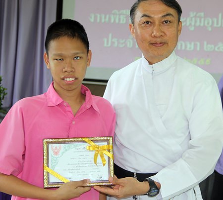 Father Peter presented certificates of excellence to the blind students.