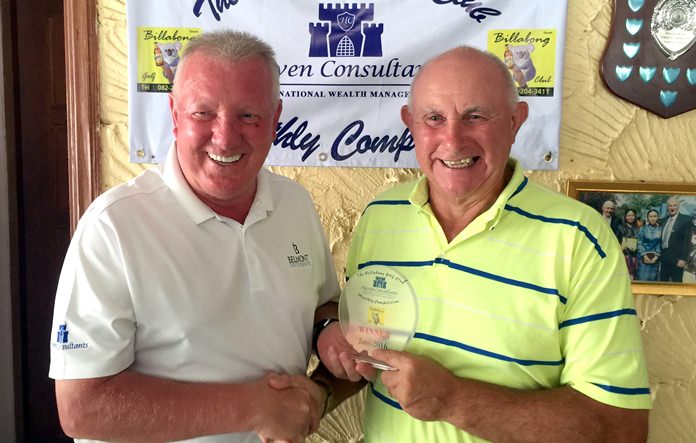 Jeff North (right) receives his medal prize.