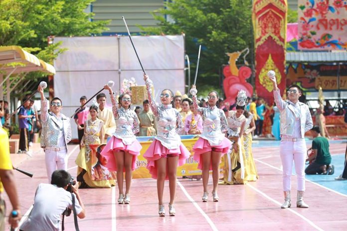 Pink team’s cheerleaders march in the opening day parade.