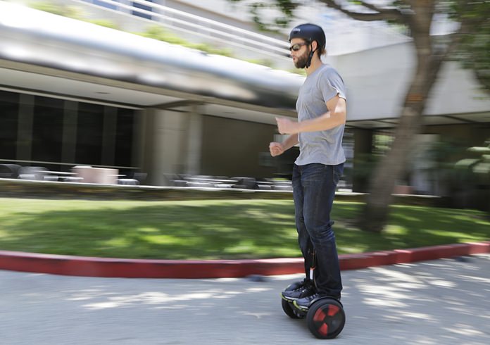 In this May 27, 2016, file photo, company representative Zach Servideo demonstrates Segway’s new self-balancing scooter, the MiniPro, in downtown Los Angeles. (AP Photo/Reed Saxon, File)