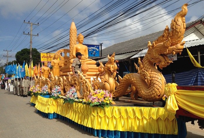 Residents bring wax candles to their local temples.