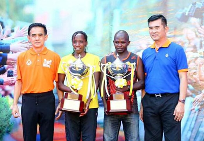 Noah Kutung Chepsergon and Wachira Tabitha Wambui are presented with the prestigious King’s Cup trophies after winning the men’s and women’s marathon races respectively.