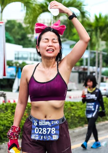 A young athlete tries to cool down after a hard race.