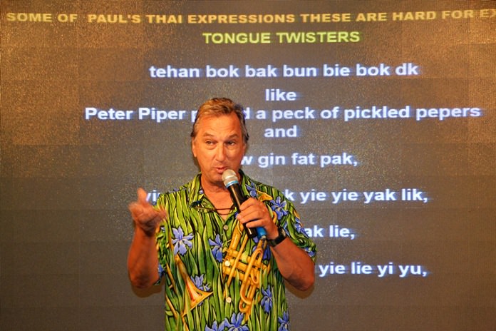 Paul Rosenberg demonstrates to his PCEC audience how the Thai language has some “tongue twisters” that are difficult to say rapidly and points out that the English language has similar expressions.