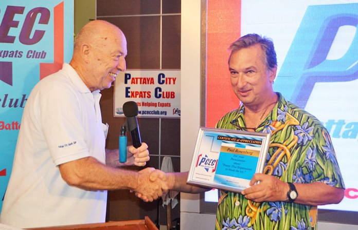 MC Roy Albiston presents Paul Rosenberg with the PCEC’s Certificate of Appreciation for his presentation on “funny Thai expressions.”