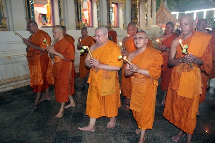 Temple monks lead the wien tien procession for Asalaha Bucha Day.