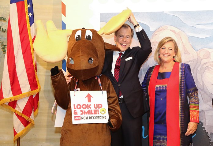 H.E. Glyn T. Davies and wife Jacqueline pose with a national park mascot.