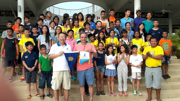 The Macao team exchanges club pennants with RVYC vice commodore.