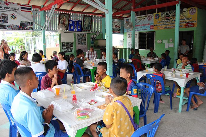 After the donation, everyone sat down for lunch with the kids.