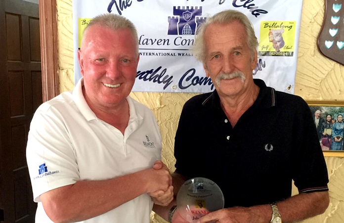 William Macey (right) accepts his medal from Brian Chapman.