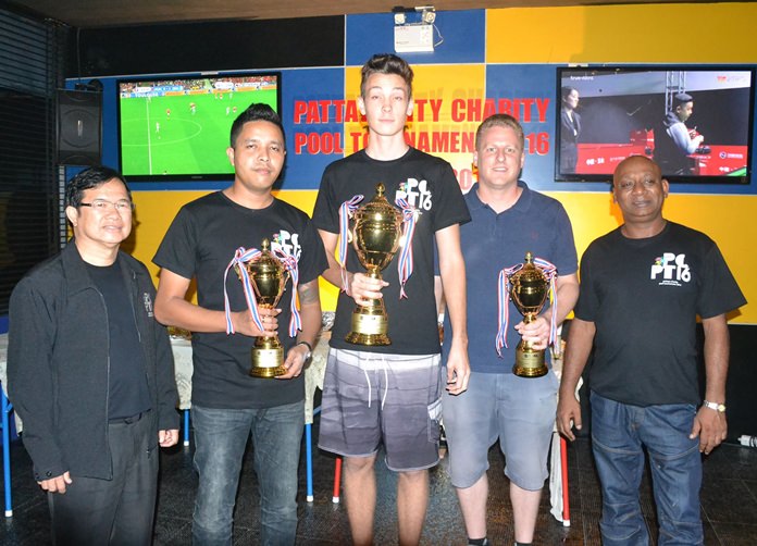 The top three players, Elias (centre), Anucha (second left) and David Bell (second right) pose with their trophies at the conclusion of the 3rd annual Pattaya Charity Pool tournament.