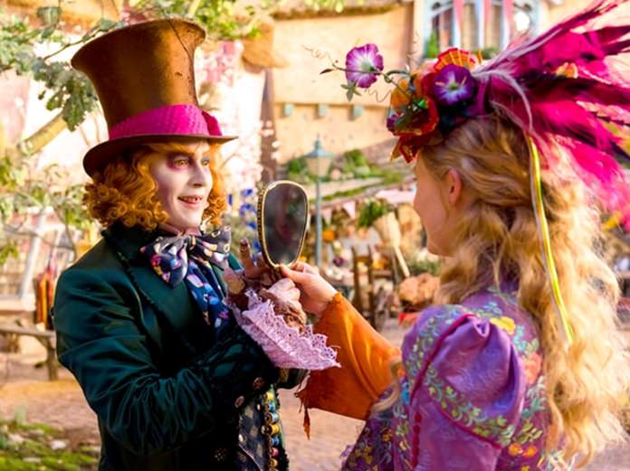 Johnny Depp as the Mad Hatter (left) and Mia Wasikowska as Alice are shown in a scene from “Alice Through the Looking Glass”. (Photo/Walt Disney Pictures)