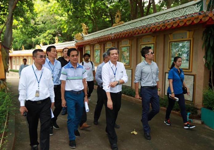 Acting Mayor Chanapong Sriviset and city legal chief Sretapol Boonsawat led a delegation of Pattaya workers to the Wang Sam Sien shrine on Big Buddha Hill for inspection ahead of work to take back the land. (PPRD)