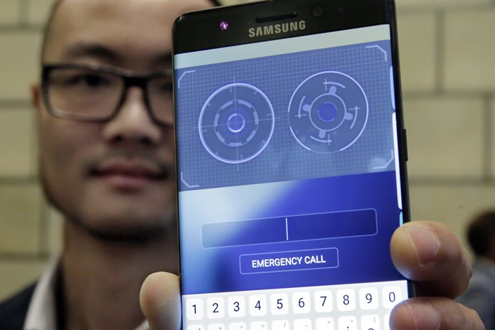 In this July 28, 2016, photo, Jonathan Wong of Samsung’s Knox Product Marketing, shows the iris scanner feature of the Galaxy Note 7, in New York. (AP Photo/Richard Drew)