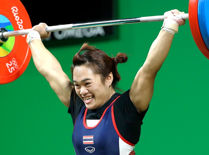 Gold medalist Sukanya Srisurat, of Thailand completes a successful lift in the women’s 58kg weightlifting competition at the 2016 Summer Olympics in Rio de Janeiro, Brazil, Monday, Aug. 8. (AP Photo/Mike Groll)