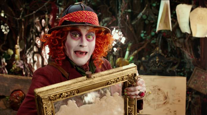 Johnny Depp portrays the Hatter in a scene from “Alice Through The Looking Glass.” The film saw one of the steepest drops ever from its predecessor. It made a staggering $740 million less than the 2010 original. (Disney via AP)