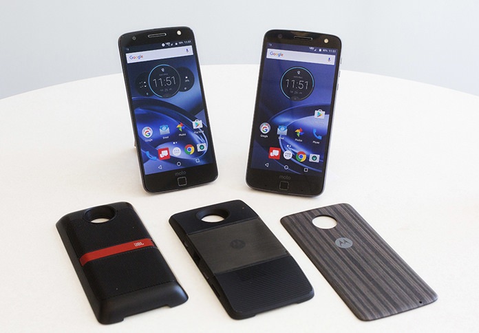 The Moto Z Droid, left, and Moto Z Force Droid phones are displayed with modules available to extend the phones’ functionality. The Moto Z adopts a modular design, which lets customers mix and match components, like Lego blocks. The modules are, from left to right, JBL speakers, a wall projector and a spare battery pack. (AP Photo/Mark Lennihan)