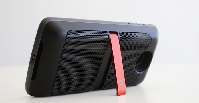 JBL SoundBoost speakers, with a red fold-out stand, are attached to the back of a Moto Z Force Droid phone, in New York. Motorola is offering mix-and-match modules to make the phone more powerful. (AP Photo/Mark Lennihan)