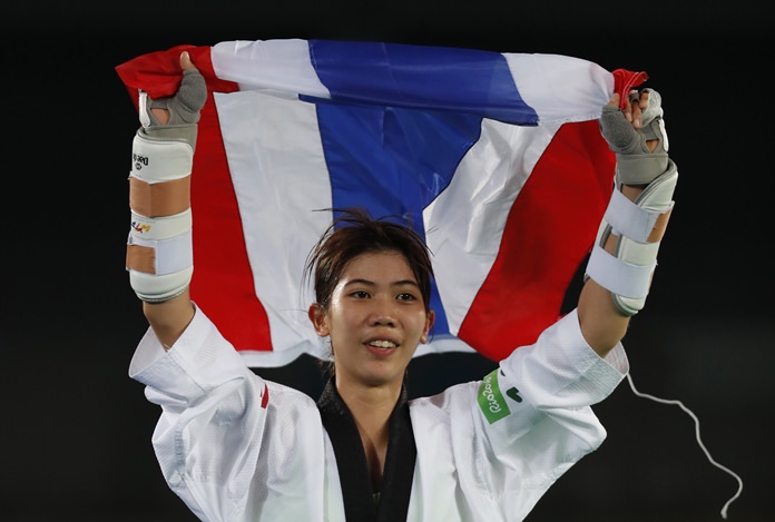 Panipak Wongpattanakit celebrates after she won bronze medal match against Adilene Manjarrez Bastidas from Mexico in women's -49kg Taekwondo match at the Olympics in Rio de Janeiro, Wednesday, Aug. 17. (AP Photo/Vincent Thian)