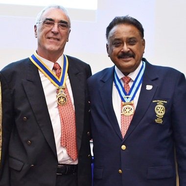 Dr Michel Roche (left) installed by PDG Peter Malhotra as President of Rotary Club Pattaya Marina.