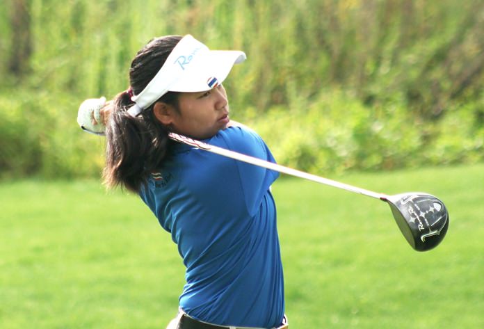 Queen tees off during the World Stars of Junior Golf tournament in Las Vegas.