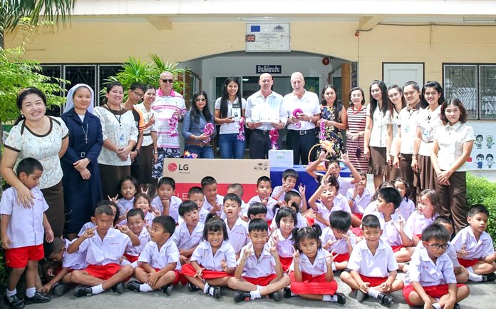 Andre Coetzee and the Outback golfers present new teaching aids and general equipment to the staff and children of the Sotpattana School for the deaf, Thursday, Sept. 8.