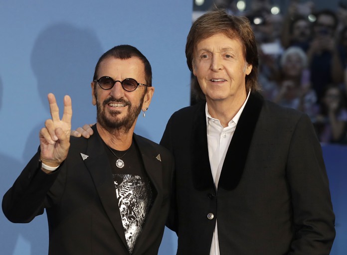 Musicians Paul McCartney (right) and Ringo Starr pose for photographers upon arrival at the World premiere of the Beatles movie, Ron Howard’s ‘Eight days a week-the touring years’ in London, Thursday, Sept. 15. (AP Photo/Kirsty Wigglesworth)