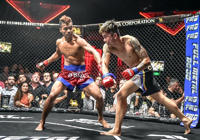 Cambodia’s Thai Rithy takes on Filipino Richard Corminal at the MMA fight night in Bangkok, Saturday, September 10. (Photo/Singaporemaven)