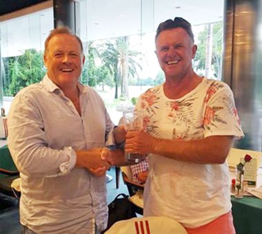 Colin Greig (right) receives his trophy after winning the Hu Hin golf tour.
