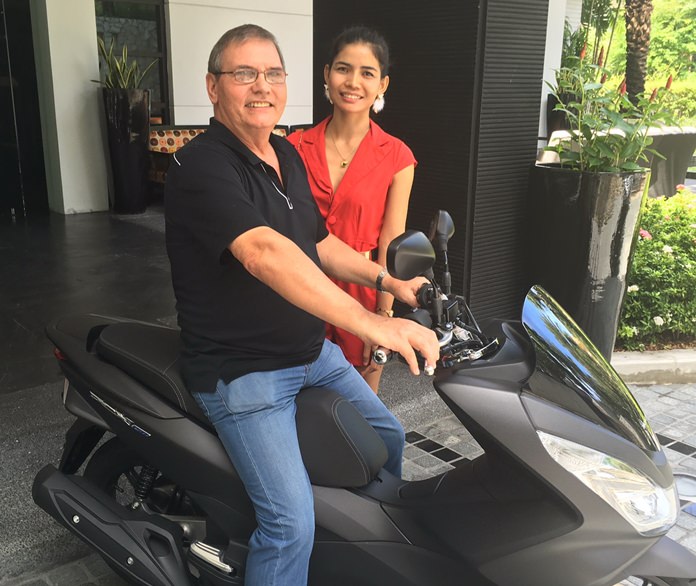 Grand Raffle grand winners Stuart and Fon Shearer happily take possession of the grand prize, a Honda PCX 150 motorcycle.