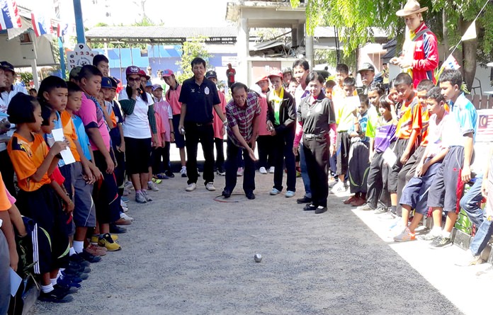 Deerek Inchom, former advisor to the mayor, pitches a boule during the charity petanque tournament held in Pattaya, Sept. 17.