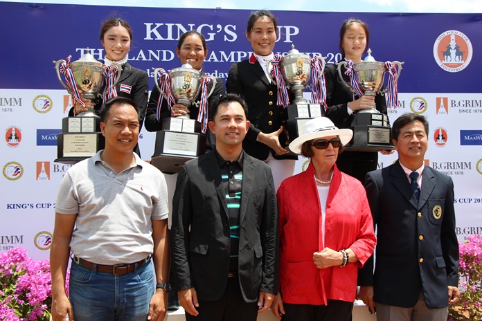 The four King’s Cup trophy winners, Rawischa Vechakorn, Jaruporn Sompichart, Areenata Cahwathanon and Patcha Sawatkijthanrong (standing rear) pose with officials and dignitaries at the conclusion of the King’s Cup Thailand Equestrian Championships 2016, held at Thai Polo & Equestrian Club in Pattaya, Sept. 18.