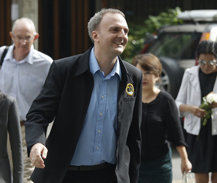 British human rights activist Andy Hall arrives at the Bangkok South Criminal Court for his verdict on criminal and civil defamation cases filed against him in Bangkok, Thailand, Tuesday, Sept. 20. (AP Photo/Sakchai Lalit)