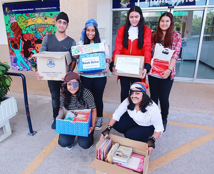 IB students help deliver donated books to a Pattaya charity.