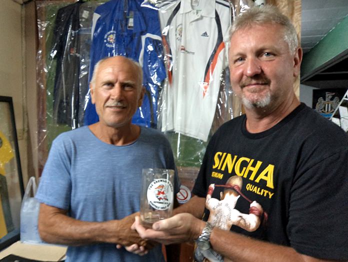 September monthly mug winner Stuart Brown (right) with Fred Cuypers.
