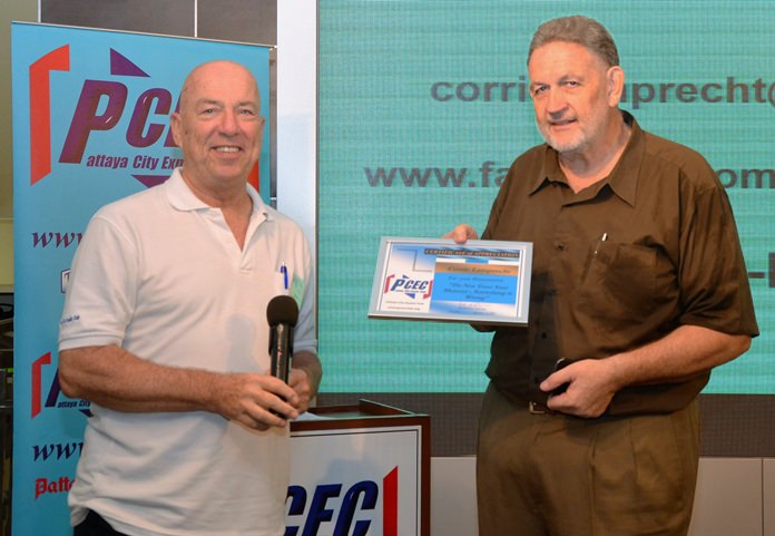 MC Roy Albiston presents Corrie Lamprecht with the PCEC’s Certificate of Appreciation for his presentation of phenomenon known as the “Mandela Effect.”