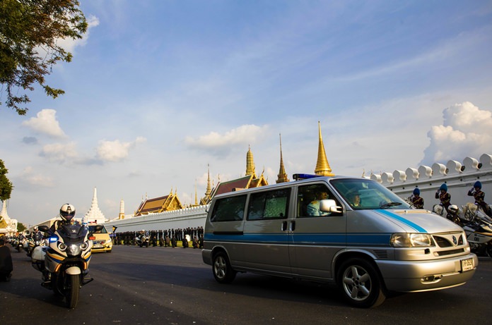 A van carrying the body of HM King Bhumibol Adulyadej leaves Siriraj Hospital for Grand Palace in a procession led by his son and heir apparent Crown Prince Vajiralongkorn in Bangkok Friday, Oct. 14, 2016. (AP Photo/Wason Wanichakorn)