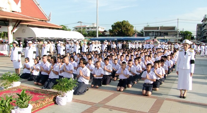 Students, along with military and political leaders and civilians pay homage to King Rama IX on Chulalongkorn Day.