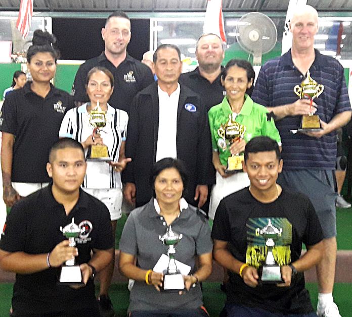 The top three teams hold their trophies as they pose with Lawn Bowls Association of Thailand President, Lieutenant General Prapat Eke-Pho. 