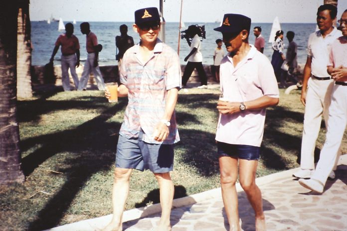HM the King and HSH Prince Bhisadej head for the dinghies at the Palace beach.