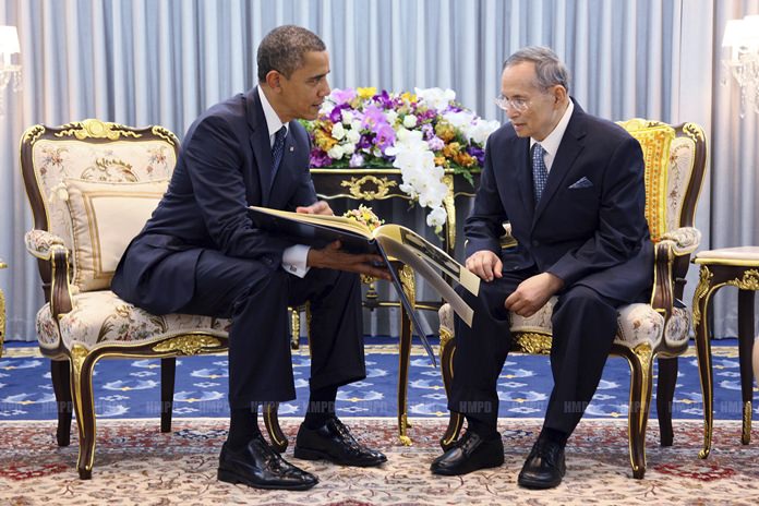 In this Nov. 18, 2012, file photo released by Thailand's Bureau of the Royal Household, U.S. President Barack Obama, left, talks with His Majesty King Bhumibol Adulyadej the Great at Siriraj Hospital in Bangkok. (Bureau of the Royal Household via AP, File)