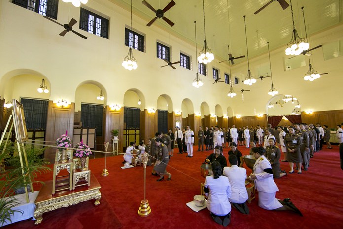 Officials line up for a bathing ceremony for HM King Bhumibol Adulyadej at the Grand Palace in Bangkok. (AP Photo/Wason Wanichakorn)