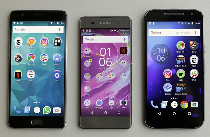 This Oct. 21, 2016, photo shows a Motorola MotoG4, right, a Sony Xperia XA, center, and a OnePlus A3000, in New York. (AP Photo/Richard Drew)